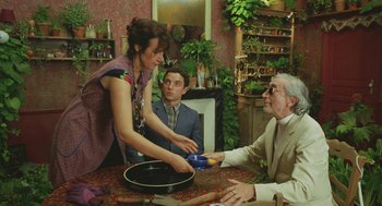 Movie still from “Attila Marcel” (2013), directed by Sylvain Chomet – A man and a woman standing in front of an older man; Medium shot, Over the shoulder angle