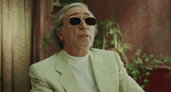 Movie still from “Attila Marcel” (2013), directed by Sylvain Chomet – An older man wearing a white jacket and sunglasses; Close Up shot, Low angle