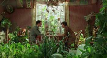 Movie still from “Attila Marcel” (2013), directed by Sylvain Chomet – A man and a woman sitting at a dining room table; Wide shot, High angle