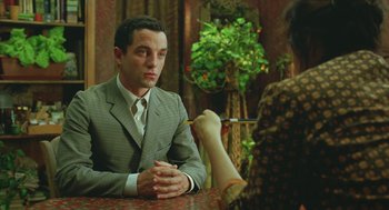 Movie still from “Attila Marcel” (2013), directed by Sylvain Chomet – A man and a woman are sitting at a table; Medium shot, Over the shoulder angle