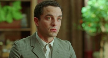 Movie still from “Attila Marcel” (2013), directed by Sylvain Chomet – A person wearing a suit and tie; Close Up shot, Low angle