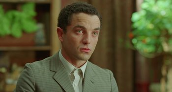 Movie still from “Attila Marcel” (2013), directed by Sylvain Chomet – A person wearing a suit and tie; Close Up shot, Low angle