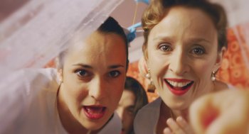 Movie still from “Attila Marcel” (2013), directed by Sylvain Chomet – Two women posing for a picture in a photo booth; Close Up shot, Low angle