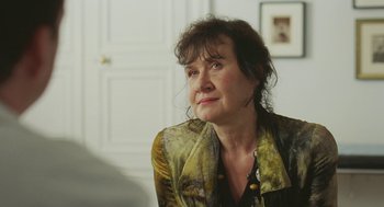 Movie still from “Attila Marcel” (2013), directed by Sylvain Chomet – A person sitting in a room near a window; Close Up shot, Over the shoulder angle