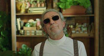 Movie still from “Attila Marcel” (2013), directed by Sylvain Chomet – An older man wearing sunglasses and a white shirt; Close Up shot, Low angle