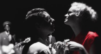 Movie still from “Attila Marcel” (2013), directed by Sylvain Chomet – A man and a woman looking into each others eyes; Close Up shot, Low angle