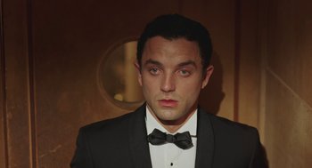 Movie still from “Attila Marcel” (2013), directed by Sylvain Chomet – A person wearing a suit and a bow tie; Close Up shot, Low angle
