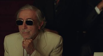 Movie still from “Attila Marcel” (2013), directed by Sylvain Chomet – An older man wearing a white suit and sunglasses; Close Up shot, Low angle
