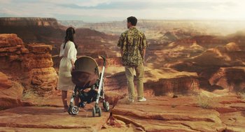 Movie still from “Attila Marcel” (2013), directed by Sylvain Chomet – A man and a woman standing next to a baby stroller; Wide shot, High angle
