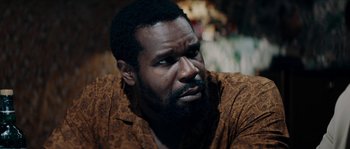 Movie still from “Avengement” (2019), directed by Jesse V. Johnson – A person with a beard; Close Up shot, Over the shoulder angle