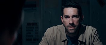 Movie still from “Avengement” (2019), directed by Jesse V. Johnson – A person wearing a jacket; Close Up shot, Over the shoulder angle