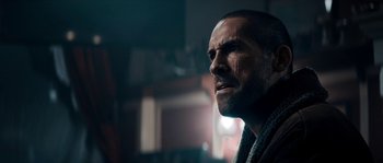 Movie still from “Avengement” (2019), directed by Jesse V. Johnson – A person with a beard; Close Up shot, Low angle