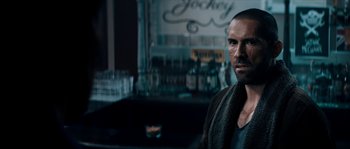 Movie still from “Avengement” (2019), directed by Jesse V. Johnson – A person in a bar; Close Up shot, Over the shoulder angle