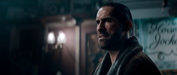 Movie still from “Avengement” (2019), directed by Jesse V. Johnson – A person with a beard; Close Up shot, Over the shoulder angle