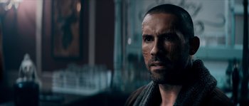 Movie still from “Avengement” (2019), directed by Jesse V. Johnson – A person with a beard; Close Up shot, Over the shoulder angle