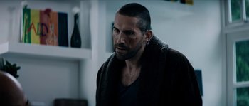 Movie still from “Avengement” (2019), directed by Jesse V. Johnson – A person with a beard; Close Up shot, Over the shoulder angle