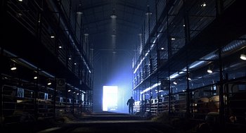 Movie still from “Babe” (1995), directed by Chris Noonan – A man standing inside of a warehouse at night; Extreme Wide shot, Low angle