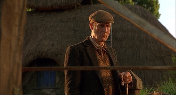 Movie still from “Babe” (1995), directed by Chris Noonan – An older man wearing a hat and holding a walking stick; Close Up shot, Low angle