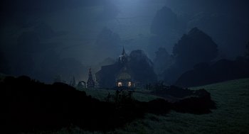 Movie still from “Babe” (1995), directed by Chris Noonan – An image of a night scene with a house in the middle of the night; Extreme Wide shot, High angle