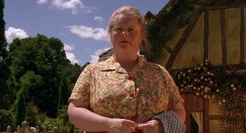 Movie still from “Babe” (1995), directed by Chris Noonan – A woman in a floral shirt holding a towel; Close Up shot, Low angle