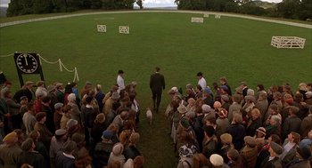 Movie still from “Babe” (1995), directed by Chris Noonan – A crowd of people standing in the grass; Extreme Wide shot, High angle