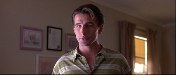 Movie still from “Backdraft” (1991), directed by Ron Howard – A person wearing a striped shirt; Close Up shot, Low angle