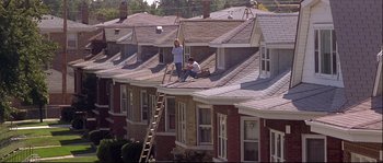 Movie still from “Backdraft” (1991), directed by Ron Howard – A couple of people standing on top of a roof; Extreme Wide shot, High angle