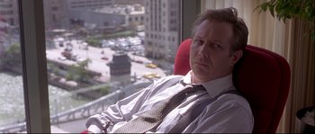 Movie still from “Backdraft” (1991), directed by Ron Howard – A person sitting in a chair near a window; Close Up shot, Over the shoulder angle