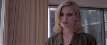 Movie still from “Backdraft” (1991), directed by Ron Howard – A woman with blonde hair is looking to her left; Close Up shot, Over the shoulder angle