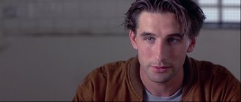 Movie still from “Backdraft” (1991), directed by Ron Howard – A person with long hair; Close Up shot, Over the shoulder angle