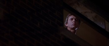 Movie still from “Backdraft” (1991), directed by Ron Howard – A man looking at himself in a mirror; Close Up shot, Low angle