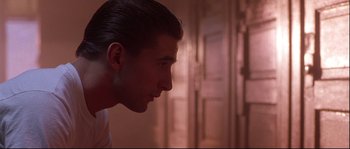 Movie still from “Backdraft” (1991), directed by Ron Howard – A person's face in a room; Close Up shot, Over the shoulder angle