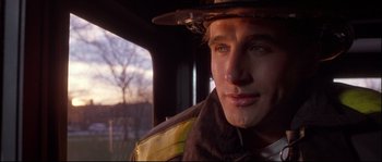 Movie still from “Backdraft” (1991), directed by Ron Howard – A person wearing a hat; Close Up shot, Low angle