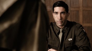 Movie still from “Band of Brothers” (2001), directed by David Frankel – A man in a uniform looking into a mirror; Close Up shot, Over the shoulder angle