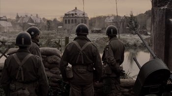 Movie still from “Band of Brothers” (2001), directed by David Frankel – A group of men standing next to each other near a river; Wide shot, Over the shoulder angle