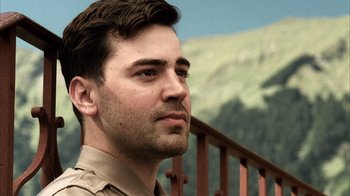 Movie still from “Band of Brothers” (2001), directed by David Frankel – A person wearing a uniform; Close Up shot, Low angle