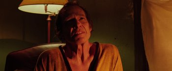 Movie still from “Band of Robbers” (2015), directed by Adam Nee – A man in a yellow shirt is looking at the camera; Close Up shot, Low angle