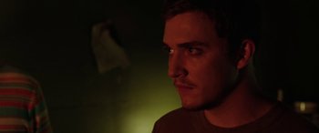 Movie still from “Band of Robbers” (2015), directed by Adam Nee – A person looking at the camera; Close Up shot, Over the shoulder angle