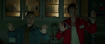 Movie still from “Band of Robbers” (2015), directed by Adam Nee – Two young men standing next to each other in a kitchen; Medium shot, Low angle