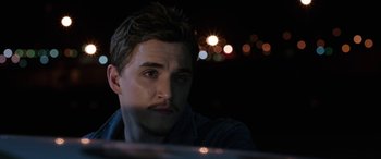 Movie still from “Band of Robbers” (2015), directed by Adam Nee – A person sitting in a car at night; Close Up shot, Over the shoulder angle