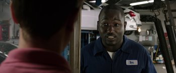 Movie still from “Band of Robbers” (2015), directed by Adam Nee – A man in a blue shirt is looking into a mirror; Close Up shot, Over the shoulder angle