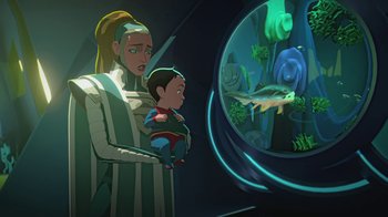 Movie still from “Batman and Superman: Battle of the Super Sons” (2022), directed by Matt Peters – A woman and a child looking into a fish tank; Medium shot, Low angle