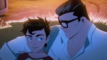 Movie still from “Batman and Superman: Battle of the Super Sons” (2022), directed by Matt Peters – A man and a boy sitting next to each other in front of a sunset; Medium shot, High angle