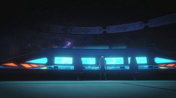 Movie still from “Batman and Superman: Battle of the Super Sons” (2022), directed by Matt Peters – A person standing in front of a large screen; Extreme Wide shot, Low angle