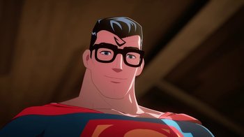 Movie still from “Batman and Superman: Battle of the Super Sons” (2022), directed by Matt Peters – A man with glasses and a superman costume; Close Up shot, Low angle