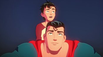 Movie still from “Batman and Superman: Battle of the Super Sons” (2022), directed by Matt Peters – A man and a boy are sitting on the back of each other; Close Up shot, Low angle