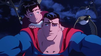 Movie still from “Batman and Superman: Battle of the Super Sons” (2022), directed by Matt Peters – A man and a woman in a superman animated movie; Medium shot, Low angle