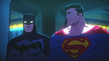 Movie still from “Batman and Superman: Battle of the Super Sons” (2022), directed by Matt Peters – A batman and a superman standing next to each other; Medium shot, Low angle