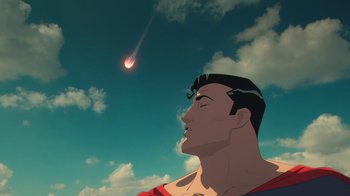 Movie still from “Batman and Superman: Battle of the Super Sons” (2022), directed by Matt Peters – A man in a superman costume looking up at an object in the sky; Close Up shot, Low angle