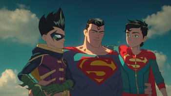Movie still from “Batman and Superman: Battle of the Super Sons” (2022), directed by Matt Peters – A group of superheroes standing next to each other; Medium shot, Low angle